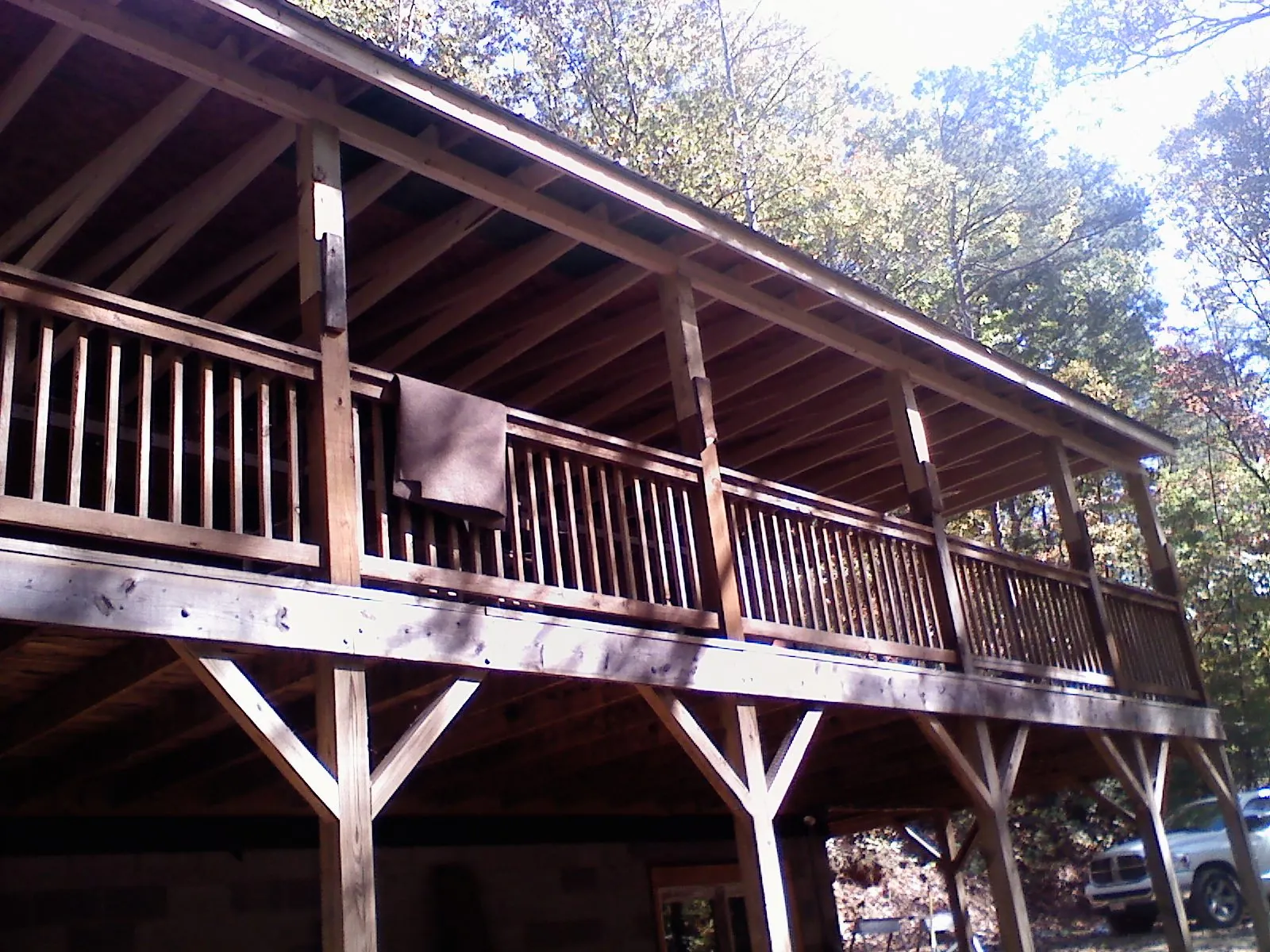Timber framing under a new elevated porch and deck — Roof Leak Repair in Boxborough by Roofing Brothers